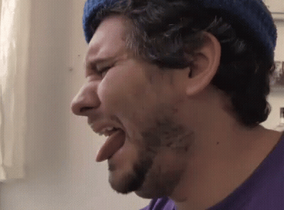 Bearded Man Sticking Tongue Out In Blue Hat GIF