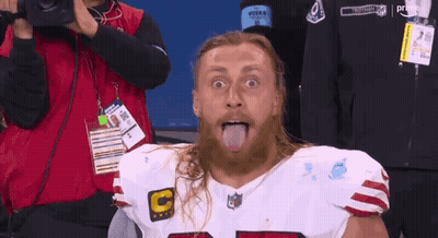 Bearded Man Sticking Tongue Out In NFL Jersey GIF