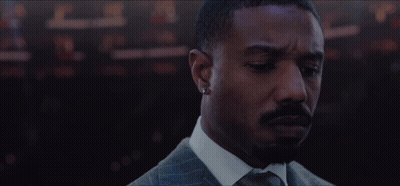 Bearded Man Suit Tie Looking At Camera GIF
