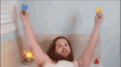 Bearded Man Taking Bath With Toys GIF