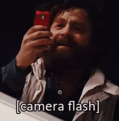 Bearded Man Taking Selfie In Mirror Camera Flash GIF