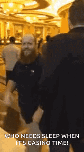 Bearded Man Talking In Casino GIF