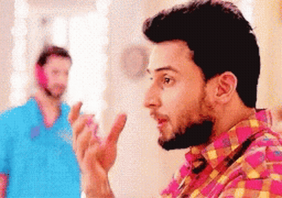 Bearded Man Talking To Man In Blue Shirt GIF