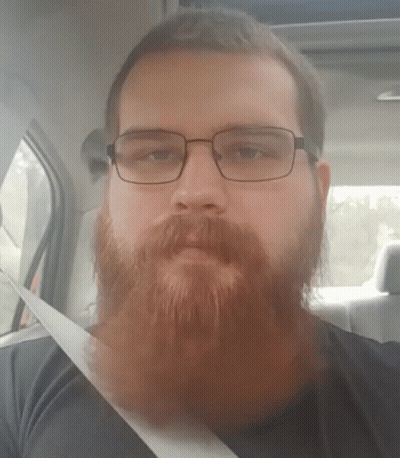 Bearded Man Wearing Glasses Sitting In Car GIF