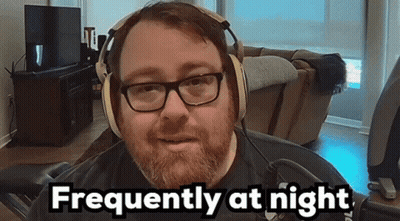 Bearded Man Wearing Headphones And 'He' Shirt GIF