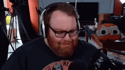 Bearded Man Wearing Headphones And 'He' Shirt GIF
