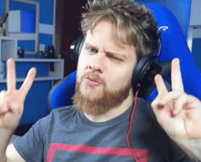 Bearded Man Wearing Headphones Making Peace Sign