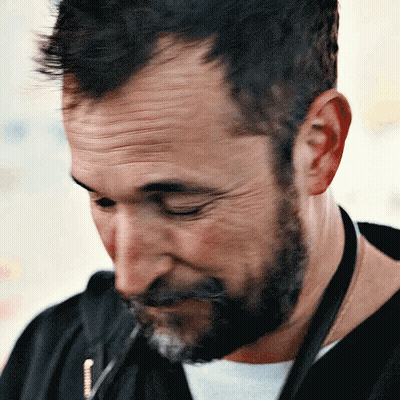Bearded Man Wearing Lanyard With Letter J GIF