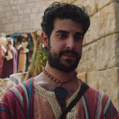 Bearded Man Wearing Necklace With Number 25 GIF