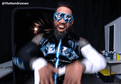 Bearded Man Wearing Sunglasses And 'Ee' Vest GIF