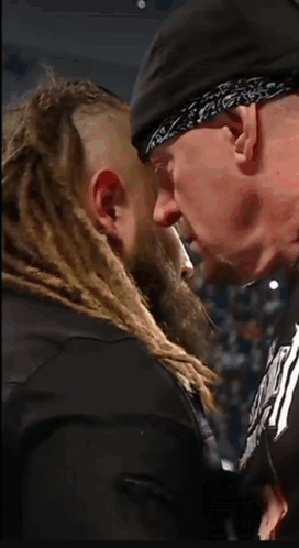 Bearded Man With Bandana Looks At Another GIF
