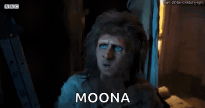 Bearded Man With Blue Eyes Sitting In Dark Room GIF