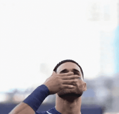 Bearded Man With Blue Wristband Reaching Up GIF