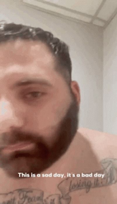 Bearded Man With Chest Tattoo Says This Is A Sad Day GIF
