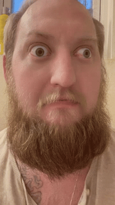 Bearded Man With Chest Tattoo Surprised GIF