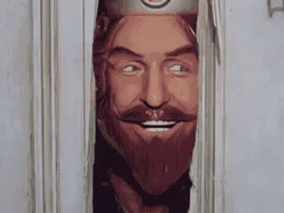Bearded Man With Crown Looking Out Doorway GIF