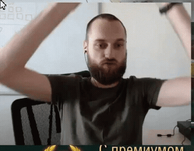 Bearded Man With Ear Buds Arms Raised GIF
