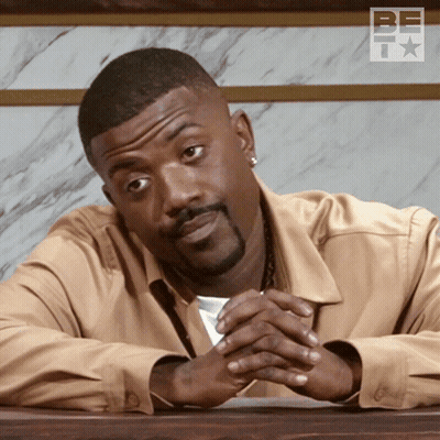 Bearded Man With Folded Hands Before Be TV Logo GIF