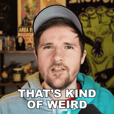 Bearded Man With Glasses And Blue Tie Making Funny Face GIF
