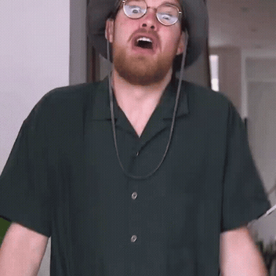 Bearded Man With Glasses And Hat Making Funny Face GIF