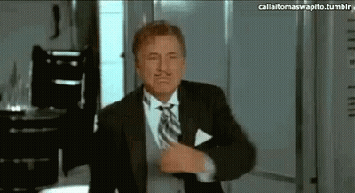 Bearded Man With Glasses By Luggage Shelf GIF