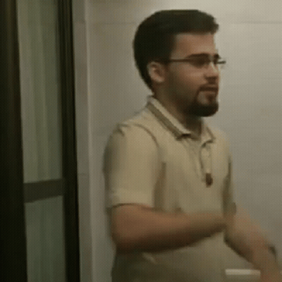 Bearded Man With Glasses In Bathroom GIF