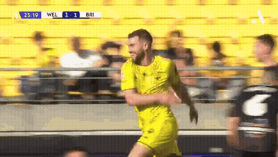 Bearded Man With Glasses Smiling In Crowd GIF
