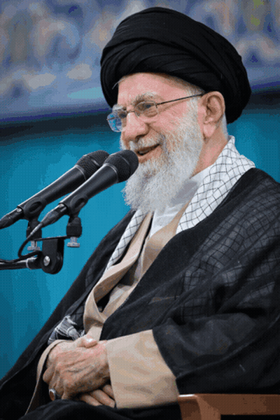 Bearded Man With Glasses Smiling Into Two Microphones GIF