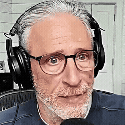 Bearded Man With Glasses Wearing Headphones Talking Into Microphone GIF