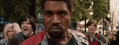 Bearded Man With Gold Chain In Crowd GIF