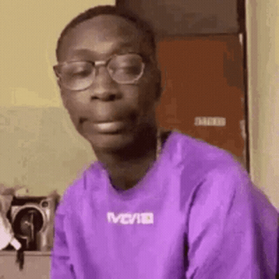 Bearded Man With Headphones And Hat Looking At Camera GIF