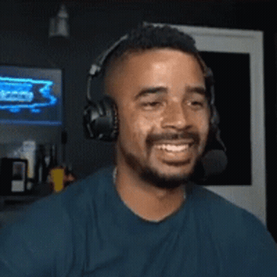 Bearded Man With Headphones And Microphone Smiling
