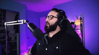 Bearded Man With Headphones Glasses At Microphone GIF