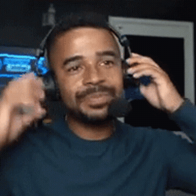 Bearded Man With Headphones Holding Microphone GIF