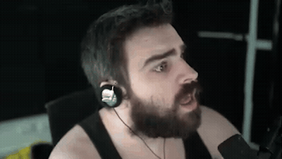 Bearded Man With Headphones Making Funny Face At Microphone GIF