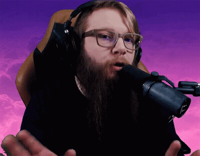 Bearded Man With Headphones Speaking Into Microphone GIF