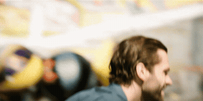 Bearded Man With Long Hair On Colorful Background GIF