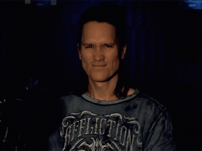 Bearded Man With Long Hair Says Rock And Roll GIF