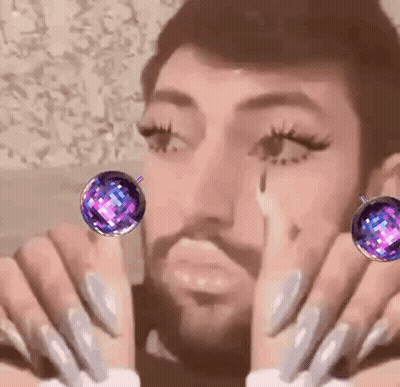 Bearded Man With Long Nails And Earrings GIF