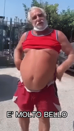 Bearded Man With Mask In Red Tank Top And Shorts GIF
