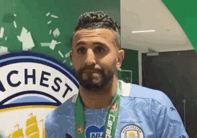 Bearded Man With Medal And Chest Logo GIF