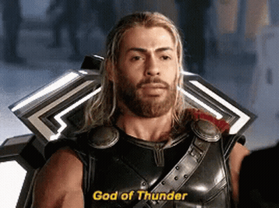 Bearded Man With Shield Saying God Of Thunder GIF