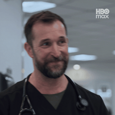 Bearded Man With Stethoscope Smiling In Front Of HBO Max Screen GIF
