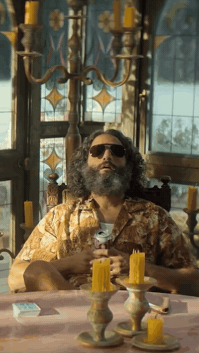 Bearded Man With Sunglasses At Candlelit Table GIF