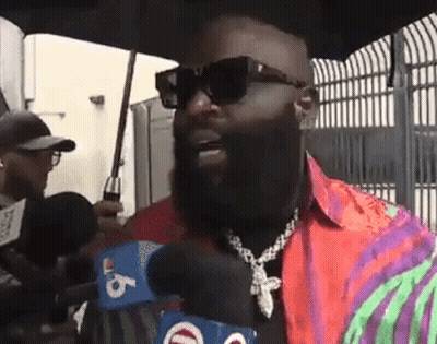 Bearded Man With Sunglasses Talking Into Microphone GIF
