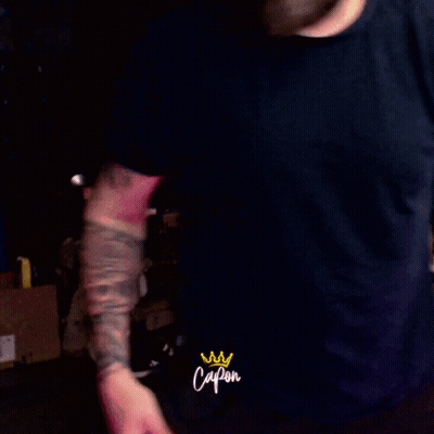 Bearded Man With Tattoos In Black Capon Shirt GIF