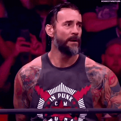Bearded Man With Tattoos In Punk Tank Top GIF