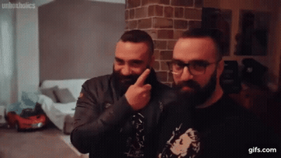 Bearded Men In Glasses Pointing At Face GIF