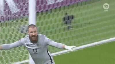 Bearded Soccer Goalie Jumping In Front Of Net GIF