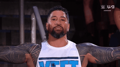 Bearded Tattooed Man In White Tank Top Saying VCT GIF